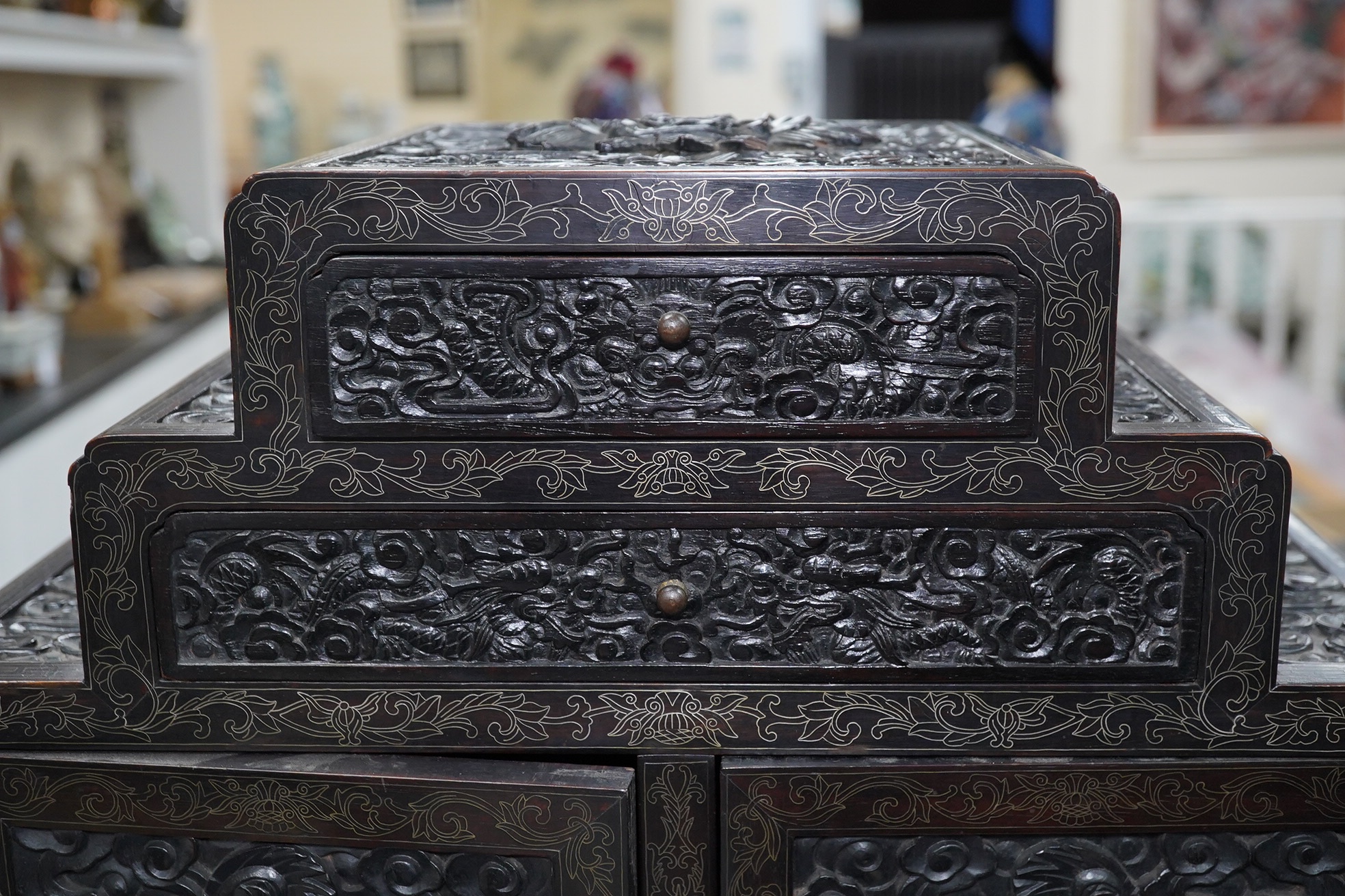 An important pair of Chinese carved zitan and silver wire inlaid ‘cloud and dragon’ curio cabinets and stands, duobaoge, probably Imperial, late Qing dynasty